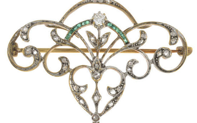 An early 20th century vari-cut diamond and emerald brooch.