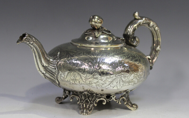 An early Victorian silver teapot with apple and leaf finial, the body squat circular engraved with b