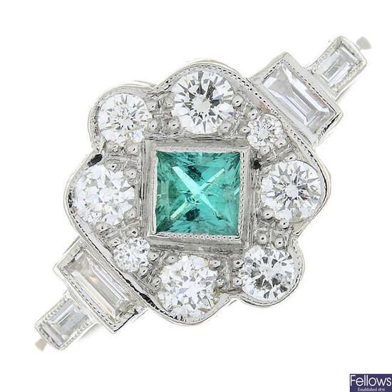 An emerald and vari-cut diamond dress ring.