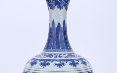 Blue and white vase with twisted branches and floral patterns