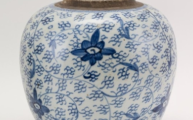 CHINESE BLUE AND WHITE PORCELAIN GINGER JAR With lotus flower and vine decoration and a double foot ring. No cover. Height 10". Diam...
