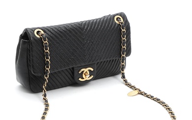 Chanel Vintage bag of black leather with golden hardware. Chain strap. One...