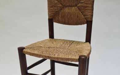 Charlotte PERRIAND (1903-1999) Chaise dite « Bauche », solitaire, à structure et piétement en bois...