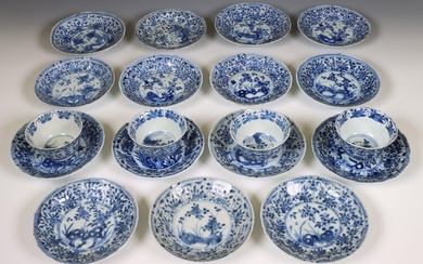 China, a set of four blue and white porcelain cups and fifteen saucers, Kangxi period (1662-1722)
