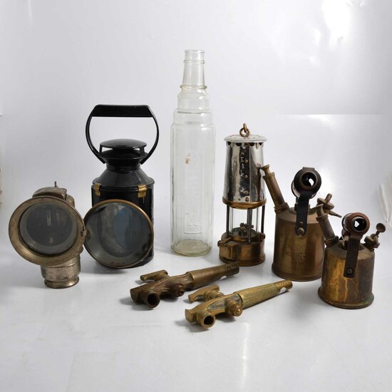 Essolube bottle, Lucas lamp, B.R. (M) lamp, miners lamp, two brass taps, two blow lamps.