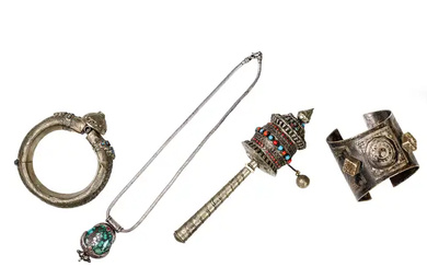 Four Tibetan white metal implements First half of 20th century Comprising: a...