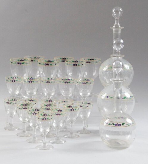 GLASS SERVICE PART, in faceted crystal with painted decoration of plums and leafy branches, comprising: six water glasses, five red wine glasses, eleven white wine glasses and three decanters (with attached stoppers). Water glass, H: 15 cm Red wine...