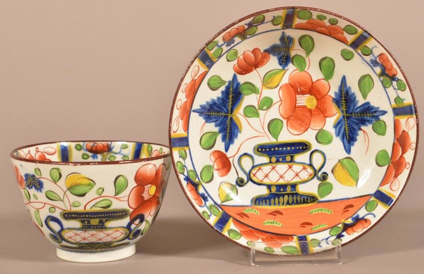 Gaudy Dutch China Urn Pattern Cup and Saucer.
