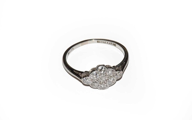Gross weight 1.9 grams. A diamond cluster ring, stamped...