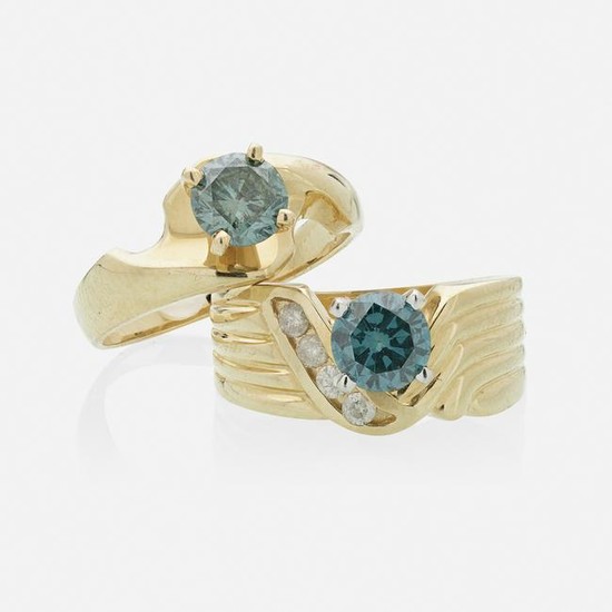 Irradiated blue diamond and yellow gold rings