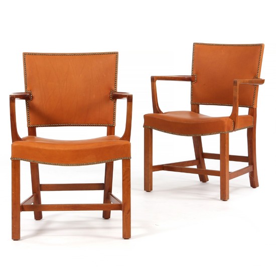 Kaare Klint: “The Red Chair”. A pair of armchairs of mahogany, upholstered with nail fitted light brown coloured leather. (2)