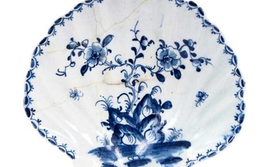 Large Lowestoft scallop-shell dish, painted in blue with flowers issuing from rockwork, moths in flight around and a 'berry' border inside the rim, 14.2cm long