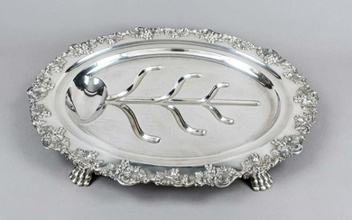 Large oval asparagus tray, 20th century, plated, on 4 paw feet, matching curved relief decoration