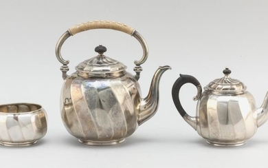 MICHELSEN .826 SILVER THREE-PIECE TEA SERVICE Includes a hot water kettle with rattan-wrapped handle, a teapot and an open sugar bow...