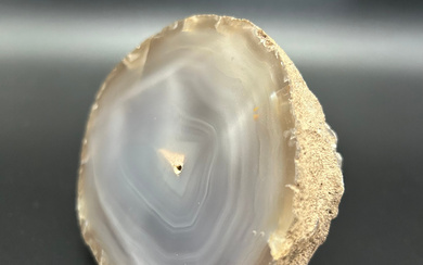 Natural beauty: polished half agate mineral crystal with cut.