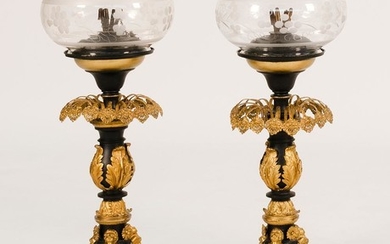 PAIR OF PARCEL-GILDED CAST METAL SINUMBRA LAMPS Shades with floral design. Neoclassical bases adorned with foliage and masks. Height...