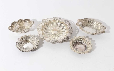 Pair of late Victorian silver embossed pin dishes (Sheffield 1895), two other pierced silver dishes and an Edwardian silver dish with pierced and embossed foliate borders, all at 6.1ozs, (5)