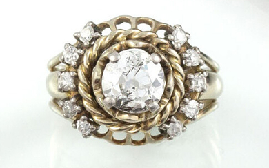 RING in 18K white gold holding an antique cut diamond...