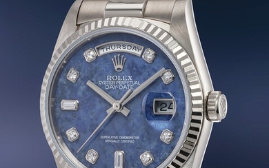 Rolex, Ref. 18239 An elegant and impressive white gold automatic wristwatch with center seconds, day, date, blue sodalite dial, diamond-set numerals and bracelet