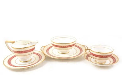 Royal Doulton bone china teaset, cream and red banded, with gilt.