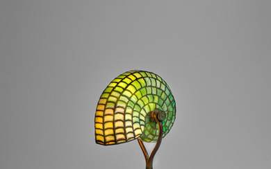 TIFFANY STUDIOS (1899-1930) Rare Nautilus Lamp1901-02leaded glass and patinated bronze, base stamped 'TIFFANY STUDIOS NEW YORK 21545'height 14 1/4in (36cm); width 5 1/2in (14cm); depth 8in (20cm)