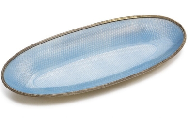The 3rd Artel, St. Petersburg 1908–1917: A Russian silver-gilt oval tray with translucent blue enamel on guilloched ground. 88 standard. L. 11.8 cm.