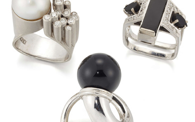 Three rings, comprising: an 18ct white gold onyx and diamond...