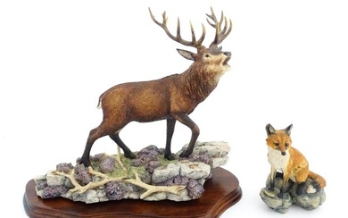 Two Border Fine Arts animal models comprising Highland Majesty B0220 by R. Roberts, and a seated fox