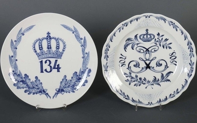 Two regiments from Meissen, after 1934 and 1860-1924, porcelain, glazed and decorated with underglaze painting in cobalt blue, one plate with crowned number 134 surrounded by a victor's wreath of oak and laurel leaves, the other plate with intertwined...