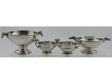 Two small silver horse related trophy cups both have two ho...