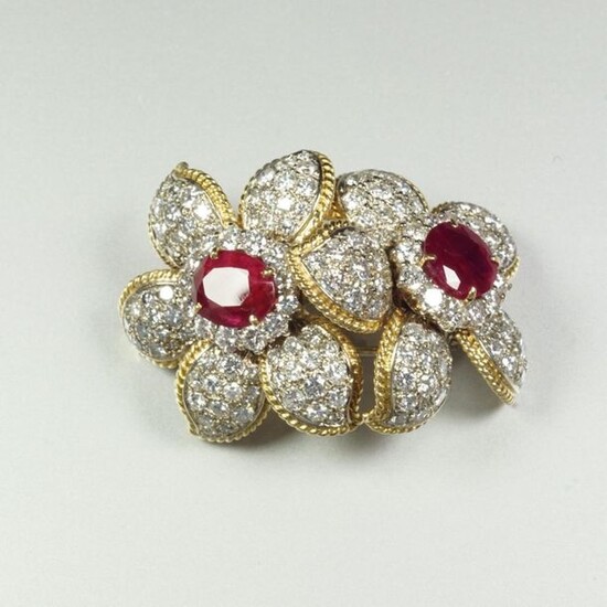 Two-tone 18K (750/oo) gold transformation brooch featuring a...