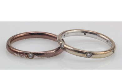 Two white gold (tests 18ct) diamond rings, to include a band...
