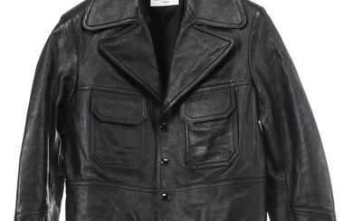 Yves Saint Laurent: A short black leather jacket made of calf leather with four black press buttons, two pockets and black lining inside. Size 42 (FR)