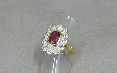 A yellow gold (eagle) ring, centred on an oval-shaped ruby...