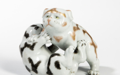 White-glazed Porcelain Figurine of Two Puppies Wrestling