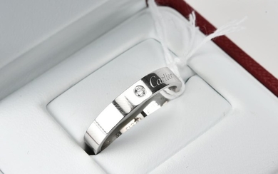 A DIAMOND WEDDING BAND IN PLATINUM BY CARTIER, BOXED