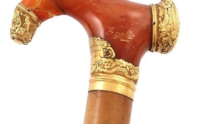 An 18th century gold-mounted amber walking cane handle,...