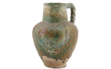 A BLACK-PAINTED TURQUOISE-GLAZED WATER JUG Possibly Raqqa, Syria,...