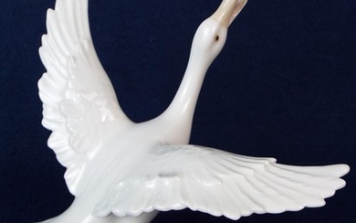 Lladro figure of a flapping goose. 5.5 inches tall. 6 inch wingspan. Perfect condition.
