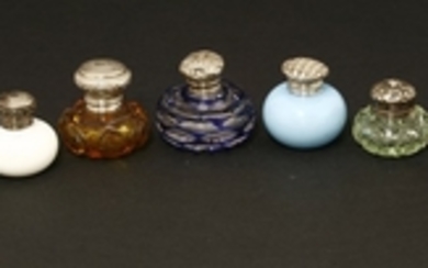 Nine small glass bottles with plated and silver mounts