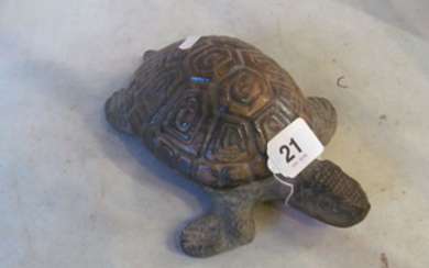 A pottery model tortoise.