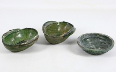 A pair of Chinese twin handled green glazed...