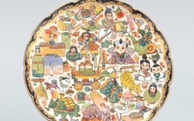 SATSUMA POTTERYPLATE With a shaped edge. Finely detailed enameled decoration of Fukurokuju surrounded by dolls, animals and other fi...