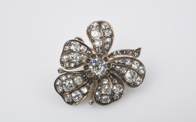 A silver, gold, and diamond brooch