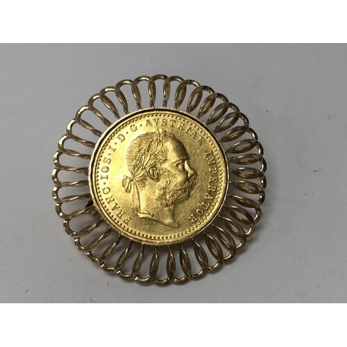 A 1915 Austrian 1 Ducat (23ct gold coin) with a 14ct gold br...