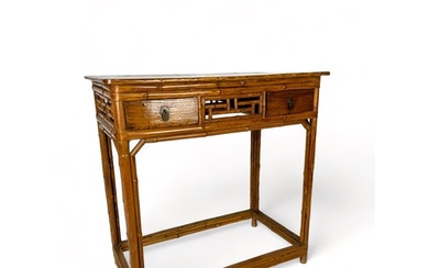 A 19th century Chinese elm and bamboo table The rectangular...