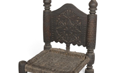 A 19th century Indian wedding chair, with carved back and wo...