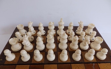 A 19thC ivory chess set, all self-coloured, having only...