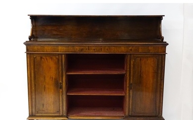 A 19thC rosewood bookcase with a moulded shelf raised on two...