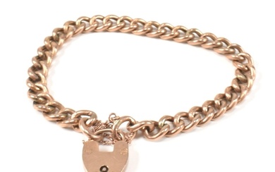 A 9ct rose gold heart padlock and curb link chain bracelet. ...